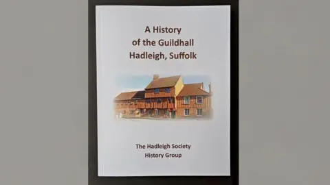 The Hadleigh Society A picture of the front of the new Hadleigh Guildhall history book. The book front is white with a picture of the building and the book's title.