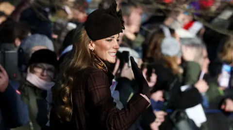 PA Media Princess of Wales waves towards the crowd outside Sandringham