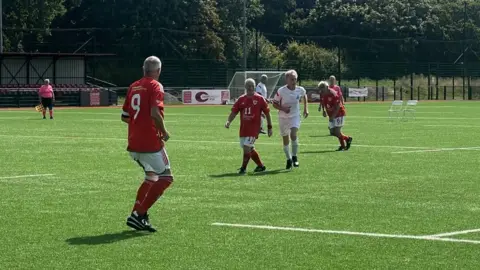 Footballers on the field during a match