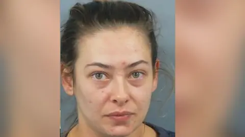 Hampshire and IOW Constabulary Courtney Strong's mugshot. She has brown hair tied back.