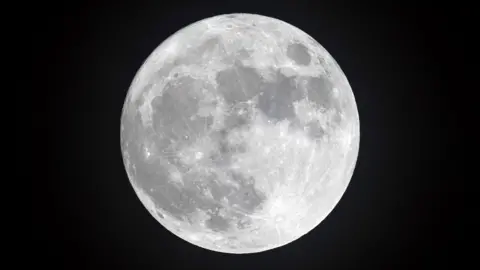 Getty Images Full Moon in dark sky