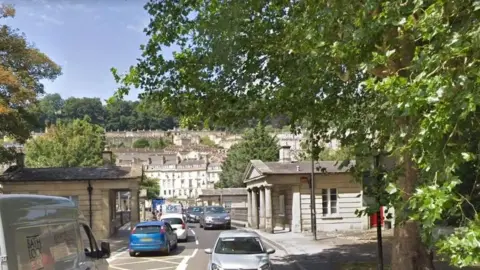 Google A road bridge in a historic city with traffic congestion on both sides of the road