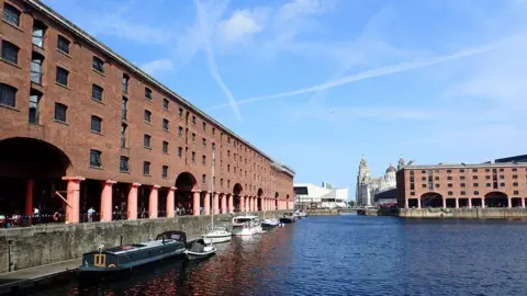 Marathon Albert Dock lined with warehouse buildings.