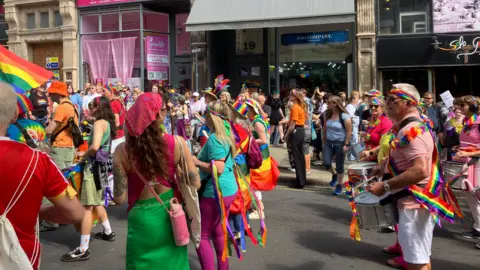 People played music during the Notts Pride march in Nottingham city centre on 25 July.