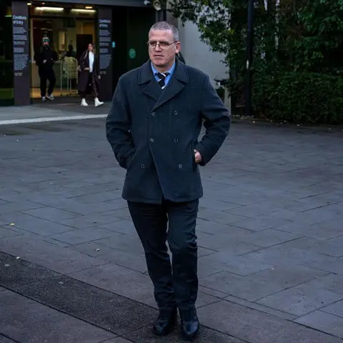 Getty Images Stephen Eppingstall in a grey coat walking outside the Morwell courthouse