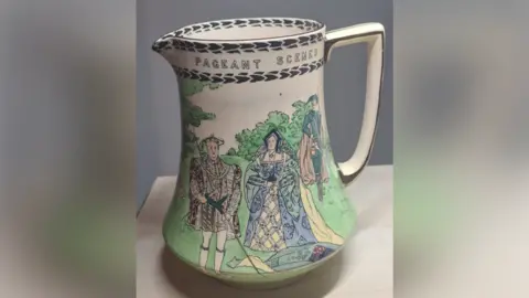 Julie Stevenson A pottery jug which has painted on it King Henry VIII and Katherine of Aragon.