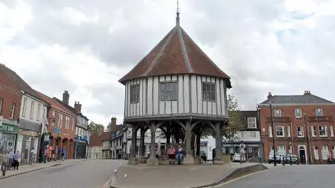 Google Market Cross, Wymondham is a timber-framed structure - an octagonal building supported over an open ground floor by eight timber buttress-like posts and a middle post 