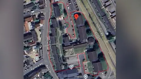 Cambs Police An aerial street view of part of a town. Some roads are marked in red signifying a closure order is in place