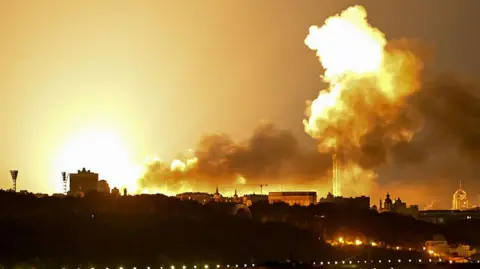 A bright yellow and white explosion during drone and missile attacks in Kyiv on June 2, 2026, amid the Russian invasion in Ukraine.