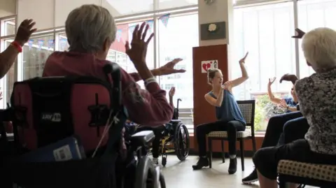 PA Media Emily Davis conducting a movement class