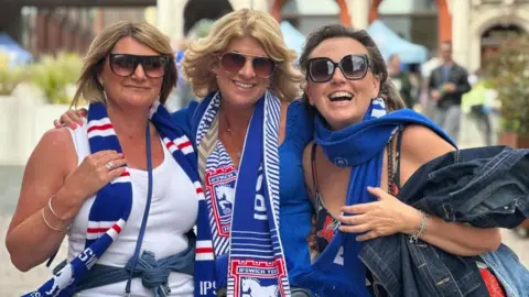 Alice Cunningham/BBC Three women Ipswich Town football fans 