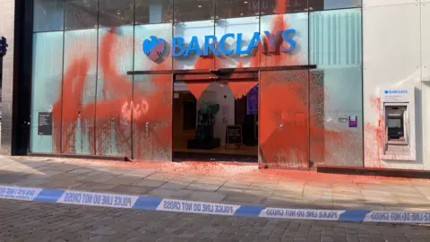 Vandalised branch of Barclays Bank in Manchester