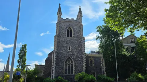 Paul Moseley/BBC We can see the church on a sunny day, with two of the pinnacles on top of the tower visible.