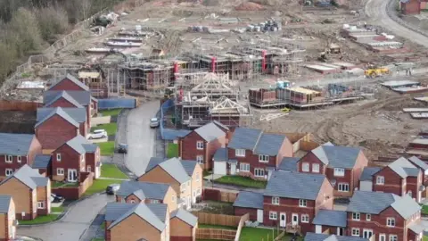 Bolsover District Council An aerial view of a new housing estate in Bolsover. Some homes are complete while others are being built.