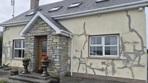 Ali Farren A house with large structural cracks 