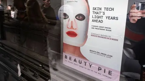 Photo of a poster advert at a London Underground station. The poster features a woman with a large white mask on her face. The text reads: Skin tech that's light years ahead
C-wave light facial treatment mask
Clinically proven to reduce wrinkles in four weeks
Beauty Pie+ price: £120
Similar products: £299
Beauty Pie: the insider beauty brand for out-of-the-box thinker
