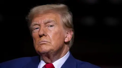 Getty Images A file photo of Donald Trump against a black background