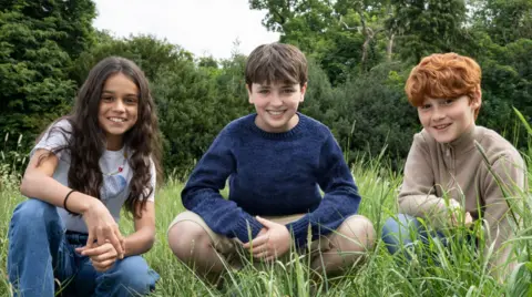 Arabella Stanton, Dominic McLaughlin and Alastair Stout smiling