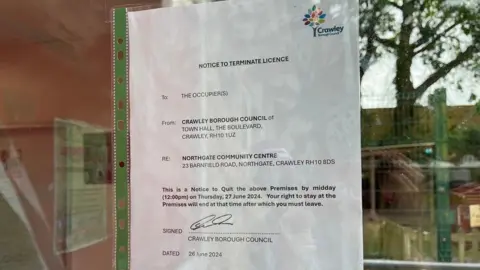 Lucinda Adam/BBC The eviction notice on the window of the Northgate Community Centre