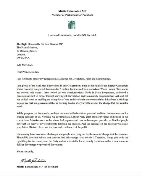 Crown Copyright Miatta Fahnbulleh's resignation letter reads: Dear Prime Minister,
I am writing to tender my resignation as Minister for Devolution, Faith and Communities.
I am proud of the work that I have done in this Government. First as the Minister for Energy Consumers where I secured energy bill discounts for 6 million families and kick started our Warm Homes Plan; and in my current role where I have rolled out our transformational Pride in Place Programme, delivered a generational shift in power through our English Devolution and Community Empowerment Act, and led our critical work on tackling the rising tide of hate and division in our communities.
It has been a privilege to play my part in a government that is working hard at every level to deliver the change that our country needs.
Whilst progress has been made, we have not acted with the vision, pace and ambition that our mandate for change demands of us. Nor have we governed as a Labour Party clear about our values and strong in our convictions.
Mistakes such as the winter fuel payment and cuts to the support provided to disabled people have left too many of my constituents doubting our mission. And the message on the doorstep was clear: you, Prime Minister, have lost the trust and confidence of the public.
Our country faces enormous challenges and people are crying out for the scale of change that this requires. The public does not believe that you can lead this change - and nor do I.
Therefore, I urge you to do the right thing for the country and the Party and set a timetable for an orderly transition so that a new team can deliver the change we promised the country."
Yours Sincerely, Miatta Fahnbulleh