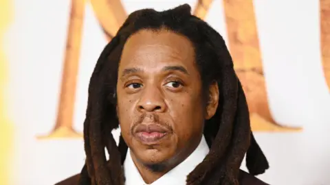 Getty Images Headshot of Jay-Z at a film premiere.