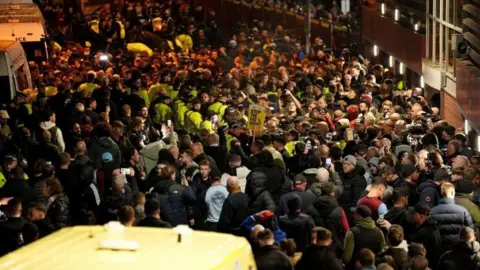 PA Media Police among fans outside the ground before the UEFA Europa League match at Villa Park, Birmingham. 