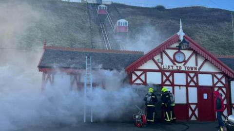 Firefighters tackling the fire at Saltburn's cliff lift