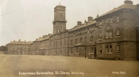 Postcard Traders Association A black and white picture of the parade ground at Inkerman Barracks in Woking in 1915.