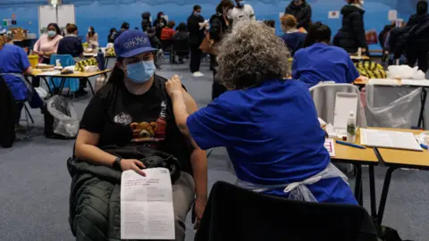 A student is given a MenB jab in a sports hall in Kent in March 2026.