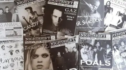 Several issues of Nightshift laid out on display. Glimpsed among the covers are bands like Glass Animals, Stornoway, Ride, and Foals.