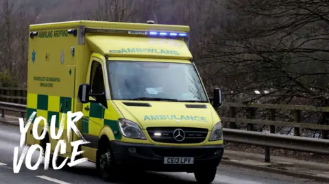 A Welsh ambulance is driving on a road. The words 'your voice' have been added to this photo.