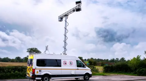 Transport for Greater Manchester A camera mounted on a white van