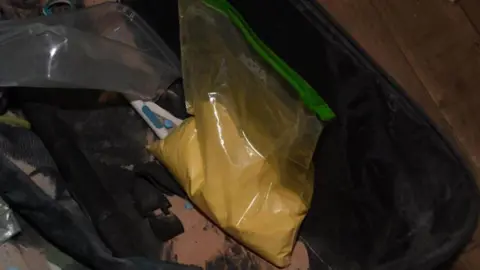 Essex Police A clear bag of yellow-coloured power