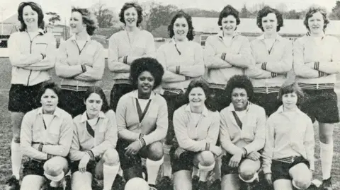 Brighton & Hove Albion FC A black and white photo of a women's football team.
