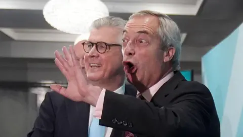 PA Media Malcolm Offord and Nigel Farage on stage at a Reform UK event in Scotland