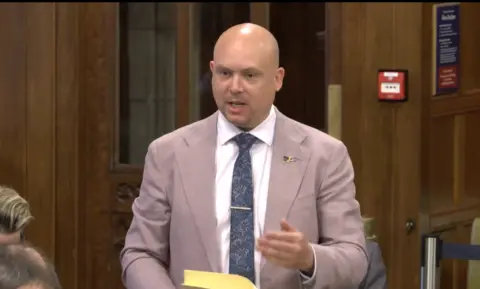 Cameron Thomas MP standing in Westminster Hall during his debate on schools funding 