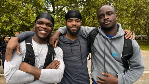 Danai Nesta Kupemba / BBC An image of the co-founders of the Ozo run club - Chibueze Odoemene (l), Emeka Atumonyogo (r) and Chigo Ogbonna (m)