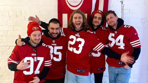 Gathering of Strangers wearing San Francisco 49ers jerserys