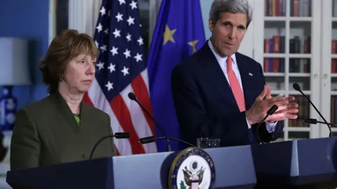 Getty Images A photo showing JCPOA lead negotiator Baroness Ashton standing alongside US Secretary of State John Kerry in 2014.