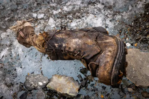 Jimmy Chin A sock embroidered with "A.C. Irvine", along with a boot, has been discovered on the Central Rongbuk Glacier below the North Face of Mount Everest by a team led by Jimmy Chin.