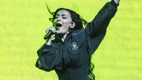 Charli XCX performing on stage