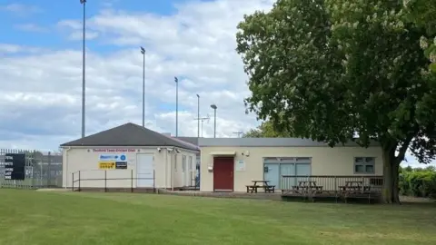 Mick Piggott Outside of Thetford Town Cricket Club