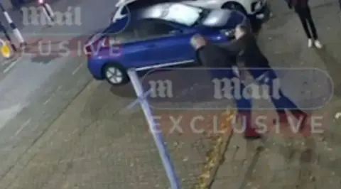 Daily Mail Footage obtained by the Daily Mail purporting to show Mike Amesbury in a street altercation