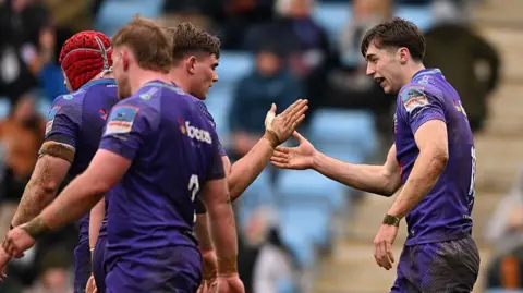 Exeter players celebrate