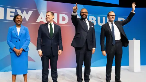 PA Badenoch, Jenrick, Cleverly and Tugendhat together on stage after delivering their speeches on the final day of the Conservative Party conference in Birmingham