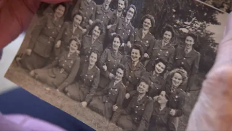 A black and white image of a group of women in military uniform.