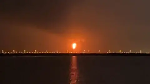 An explosion in Qatar's Ras Laffan industrial zone lighting up the night sky orange