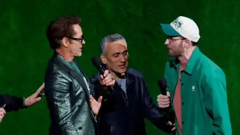 Getty Images Robert Downey Jr, director Joe Russo and Chris Evans