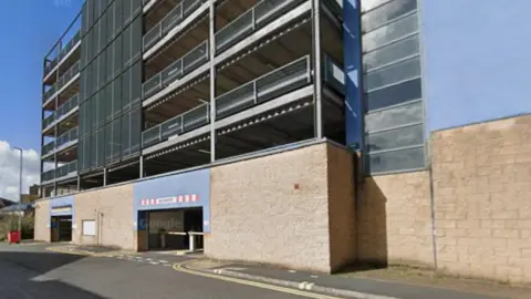 Google The exterior of a multi-storey bricked building. 