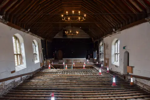 West Norfolk Borough Council Interior of St Georges Guildhall. The floor has been taken up to show the Medieval wooden slats which would have formed the original stage. 